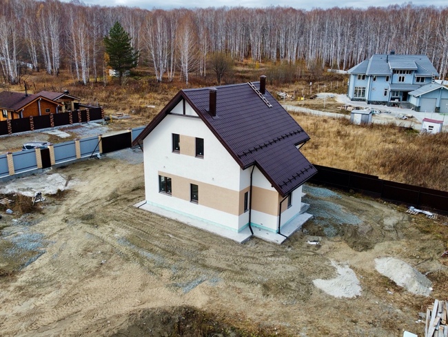 Дом с отделкой фасада мокрой штукатуркой ГК Урал-Строй